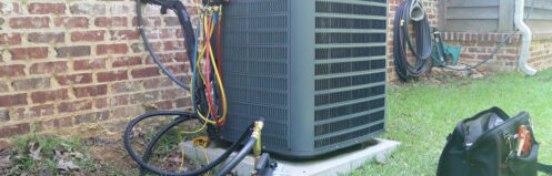 An AC unit getting maintenance in Williams Lake