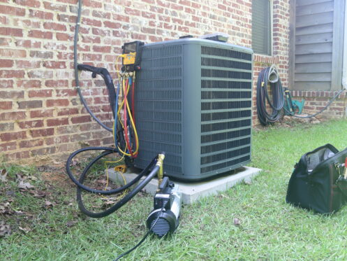 An AC unit getting maintenance in Williams Lake