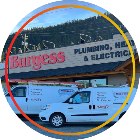 front of the Burgess company building with vans and trucks parked in front