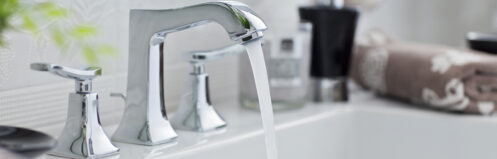 Clean water flowing from a bathroom faucet
