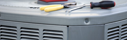 tools on air conditioner condenser residential unit